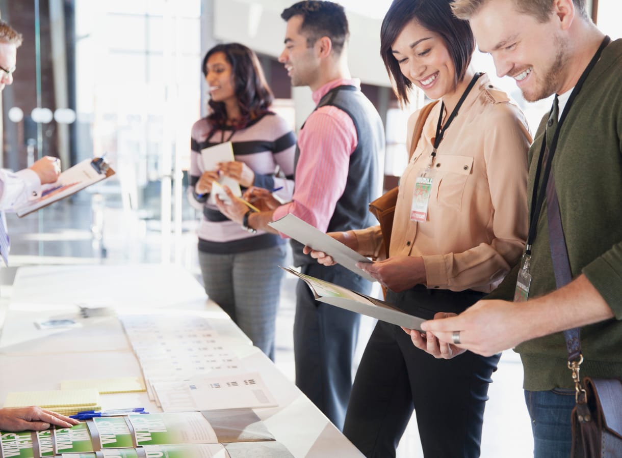 People checking into an event